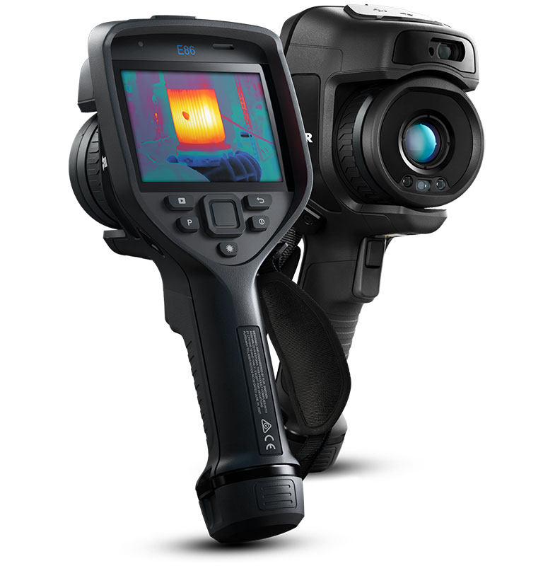 Two Teledyne FLIR E86 Thermal Cameras. One faces forwards and one faces backwards with a thermal image visible on its display. 