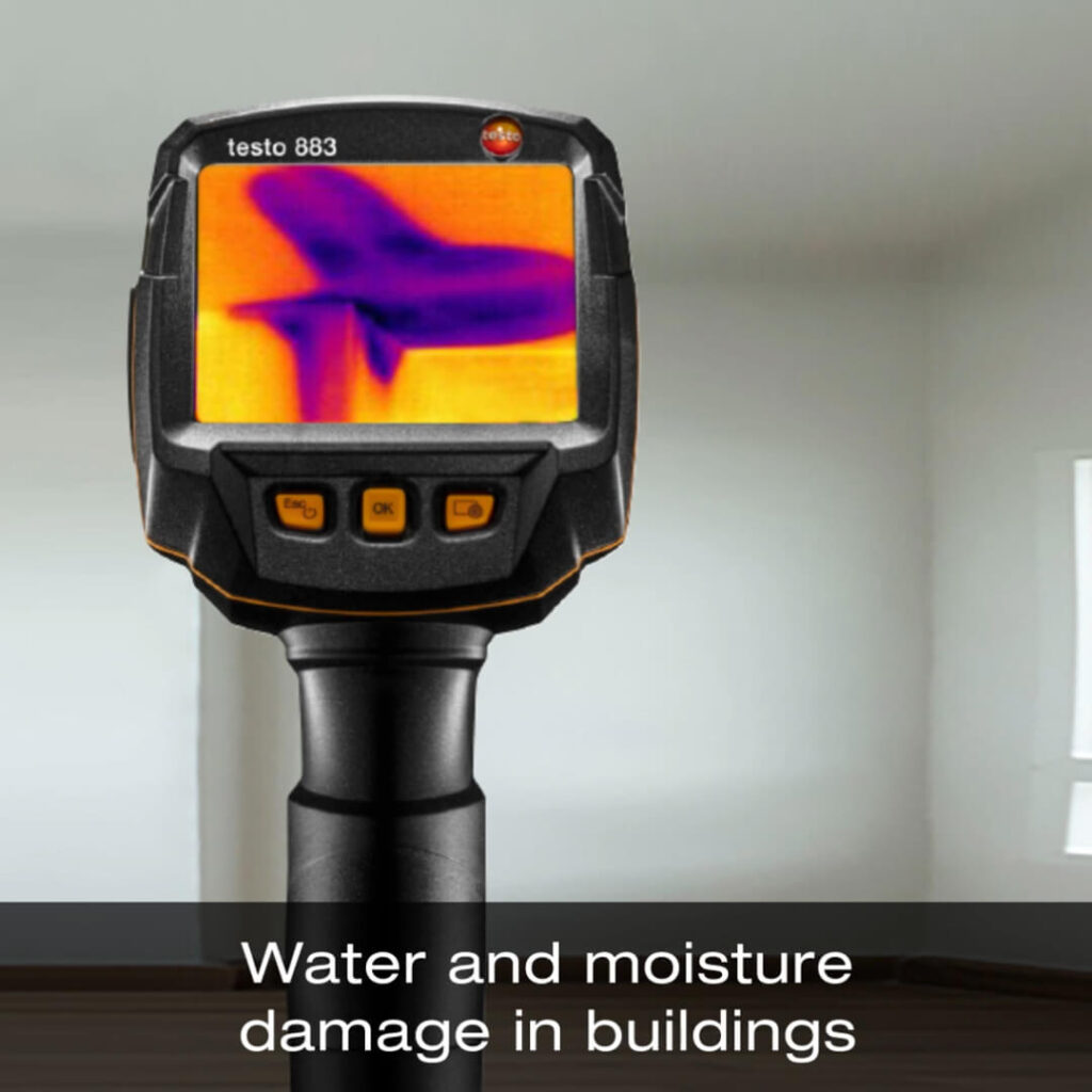 A Testo thermal camera shows water and moisture damage along the vertex of the wall and ceiling. A label at the bottom of the image reads "Water and moisture damage in buildings."