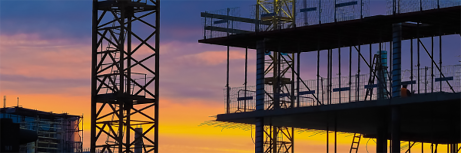 A sunset image of construction scaffolding. 