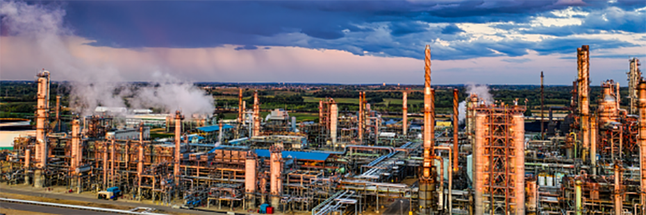 An aerial photo of an industrial/manufacturing plant at sunrise. 