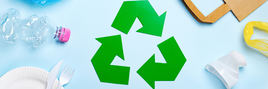 A recycling symbol is in the centre of a light blue background it. Surrounding it (from the bottom left corner going clockwise to the bottom right) are a paper plate with a plastic knife and fork, a crumpled plastic bottle, paper bag, and a crumpled white plastic cup. 