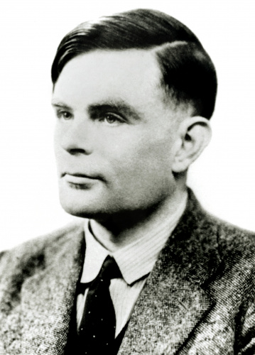 Profile black and white photo portrait of Alan Turing in a suit and tie.  