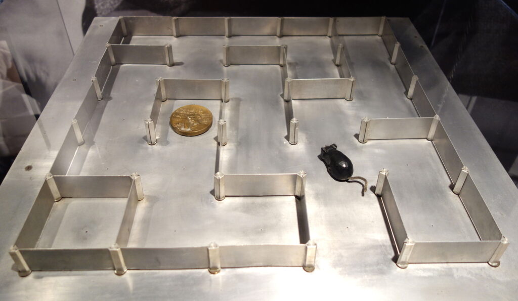 The electromechanical mouse Theseus in a metal maze.