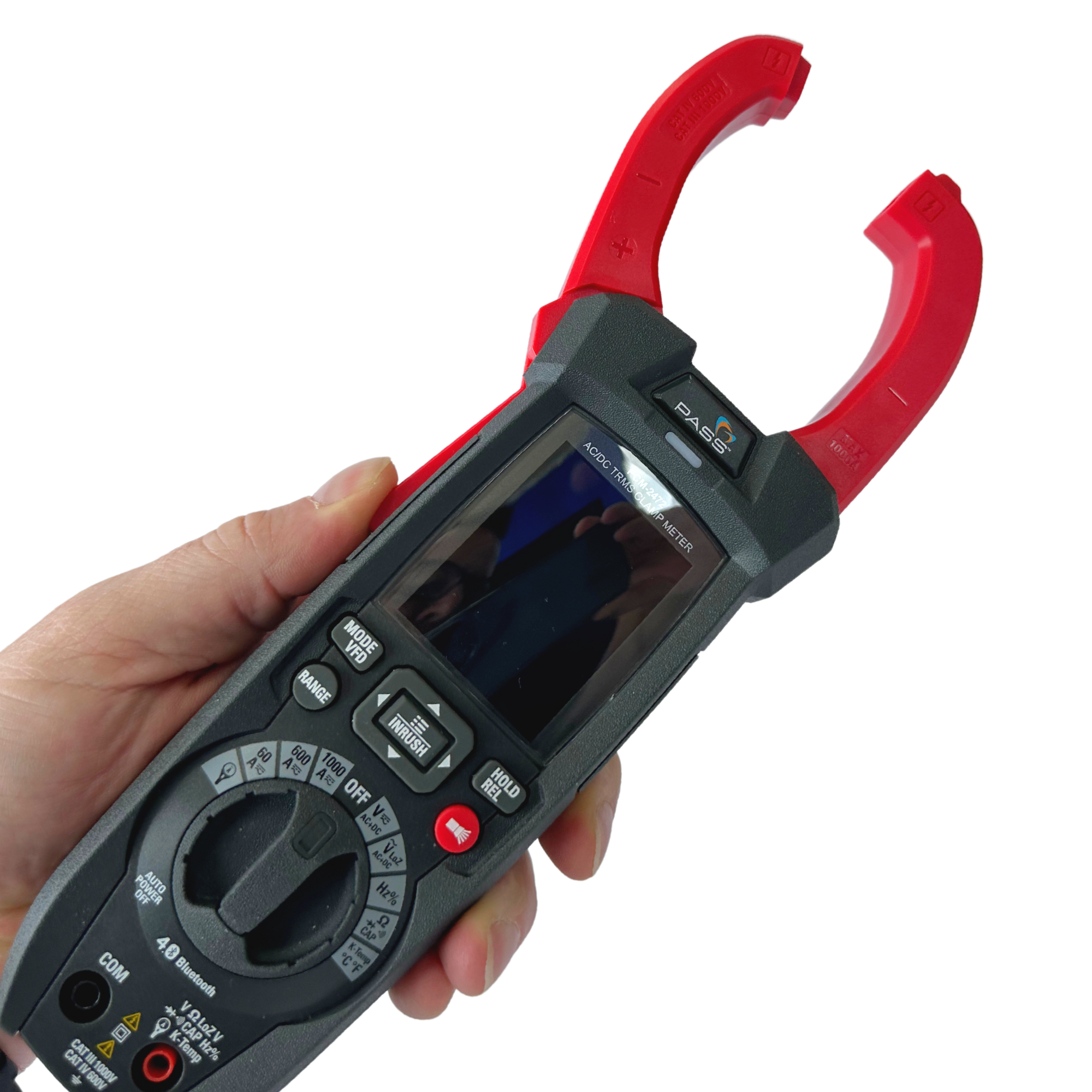 A man holds the PCM-2472 Clamp Meter, pressing it so that the red jaws are open.